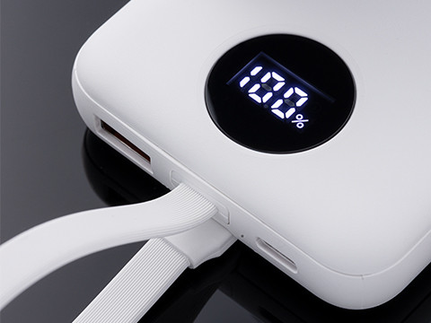 White power bank with integrated charging cable and digital battery level display on a black background.