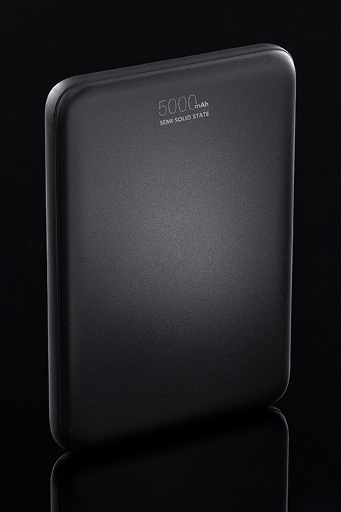 Black power bank with slim design and capacity marking shown as a product image on a dark background.