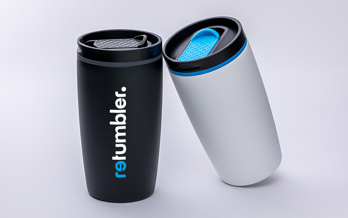 Two myMetz thermal mugs by RETUMBLER, one black, one white, on a light background